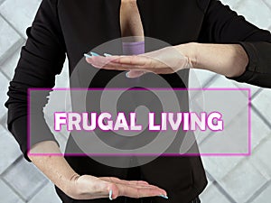 FRUGAL LIVING inscription on the screen.  Frugal livingÂ is the act of being very intentional with your spending
